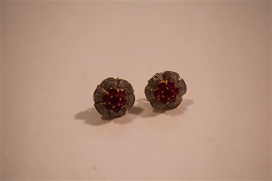 A pair of gold, ruby and diamond flowerhead earrings.